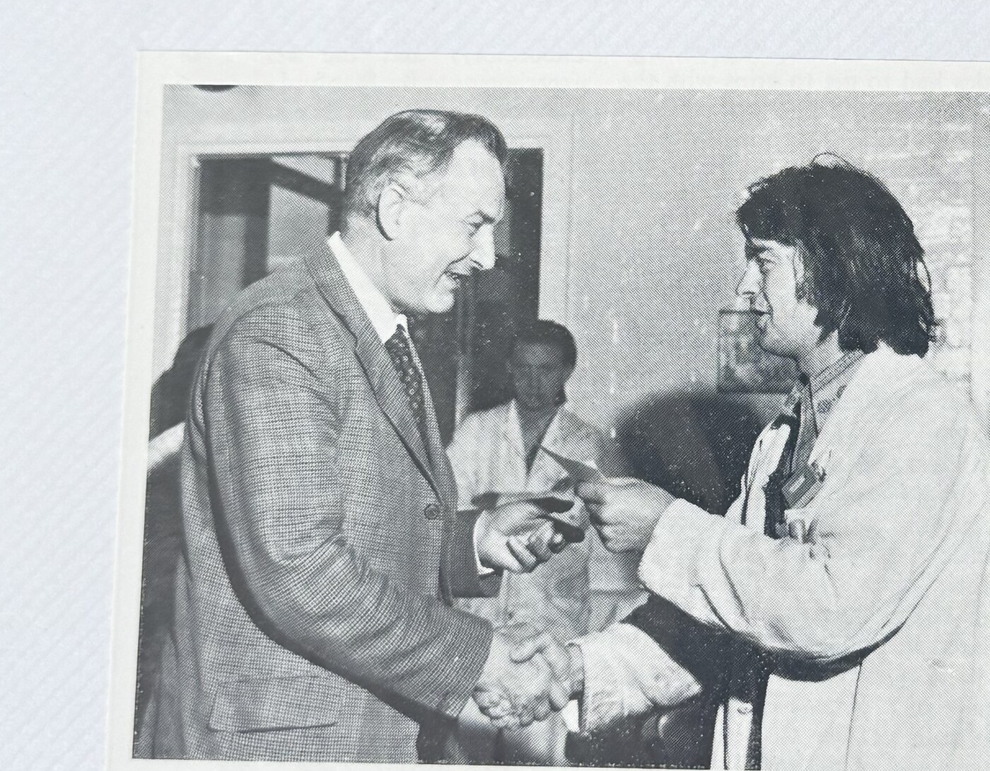 Ron Russell presenting Brian Smith with his Suggestion Award cheque, 1974